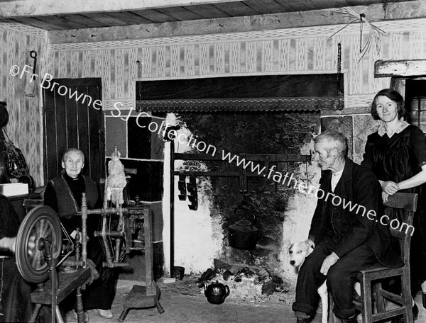 IN A COTTAGE HOUSE NEAR DRUMSHANBO WHERE THERE WAS HOME SPINNING  FR.CONEFREY & FR. GARAHY